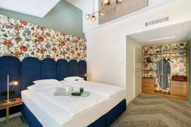 Junior suite met 1 kingsize bed en slaapbank, rookvrij — ARCOTEL Wimberger