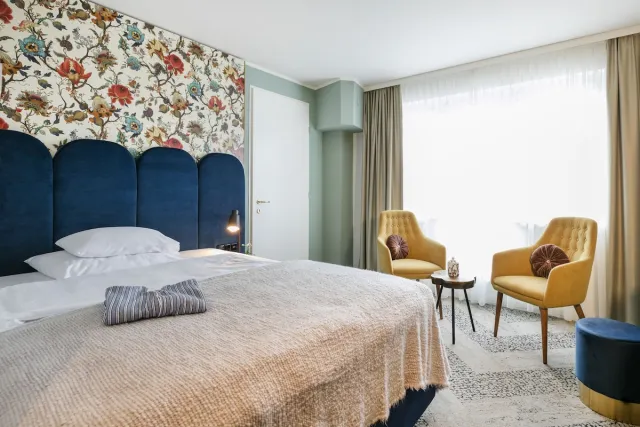 Suite met 1 kingsize bed en slaapbank, rookvrij — ARCOTEL Wimberger